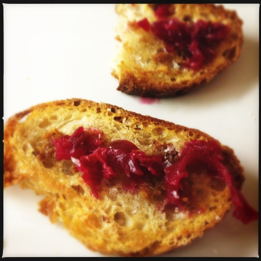 Crostini with proscuitto fat and beet relish